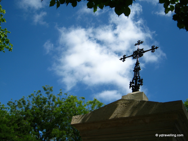 Montparnasse cemetery, cross against a blue sky